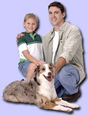 Father and son with dog